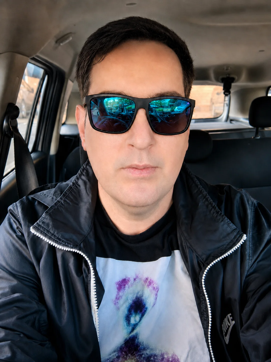 Shafaet wearing sunglasses in a car